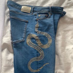 Roberto Cavalli designer jeans with snake detail